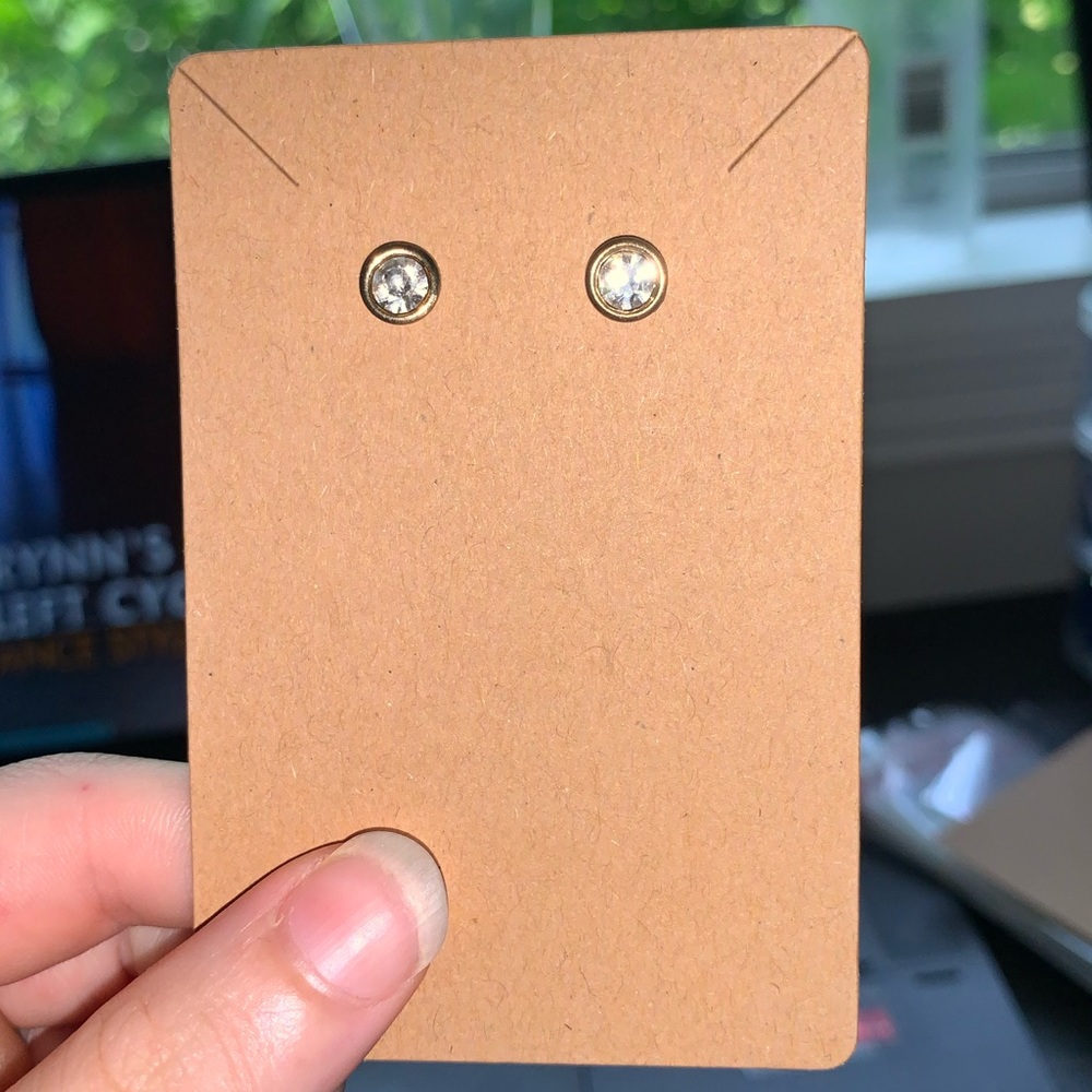 Gold and diamond stud earrings. With plastic backs.